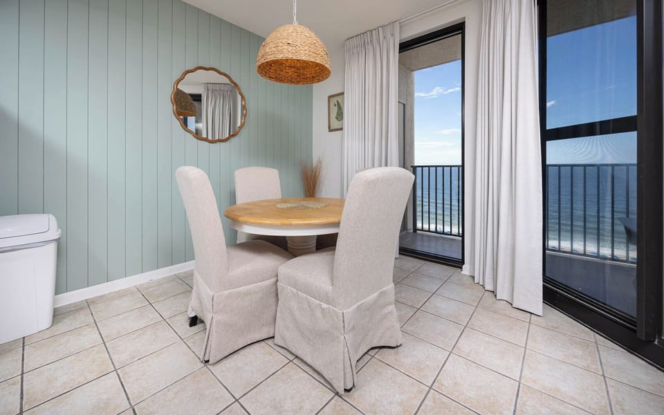 Dine at the round table while enjoying the calming views through the large windows and soft natural light