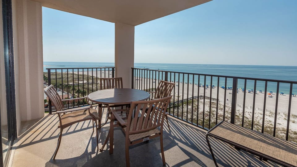Enjoy meals or drinks while taking in the beautiful beachfront view from your balcony