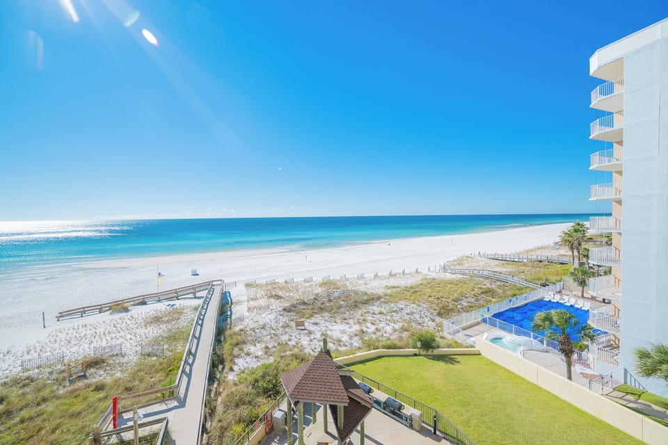 Enjoy the captivating beach views while listening to the gentle waves below