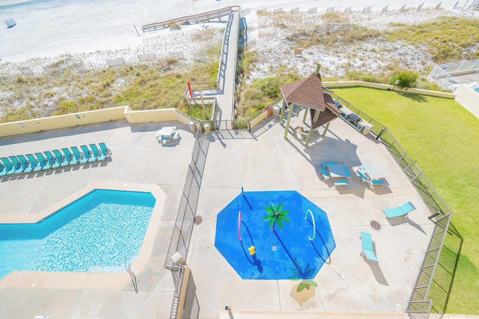 Splash into family fun at the colorful water play area while soaking up the sun by the inviting poolside