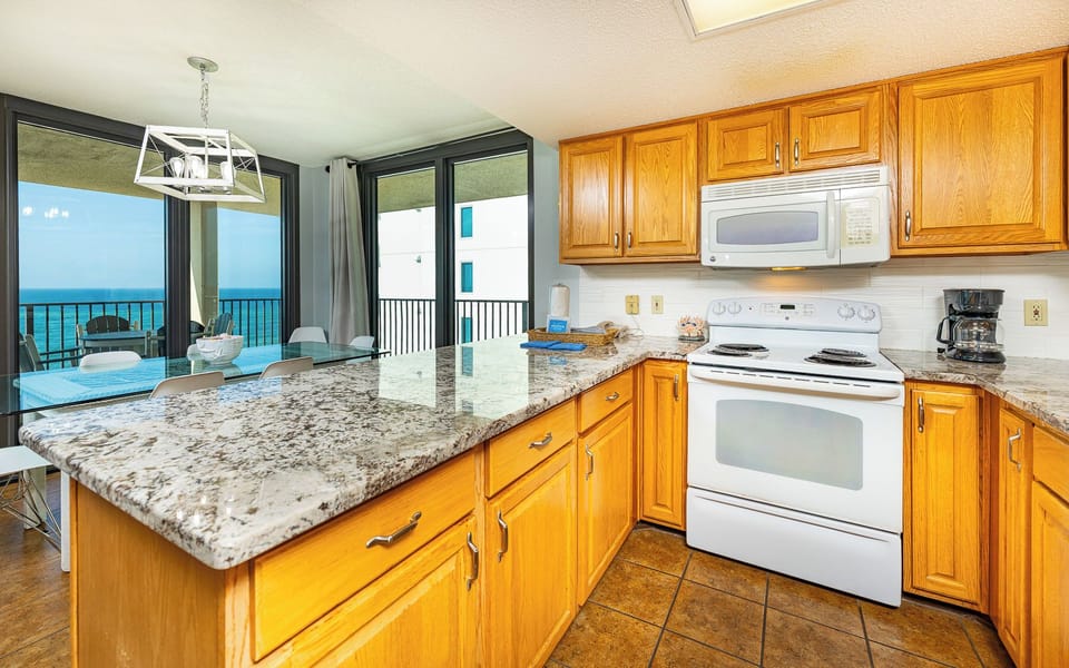 Prepare snacks at the kitchen counter as you relish quality family time with coastal views through the windows