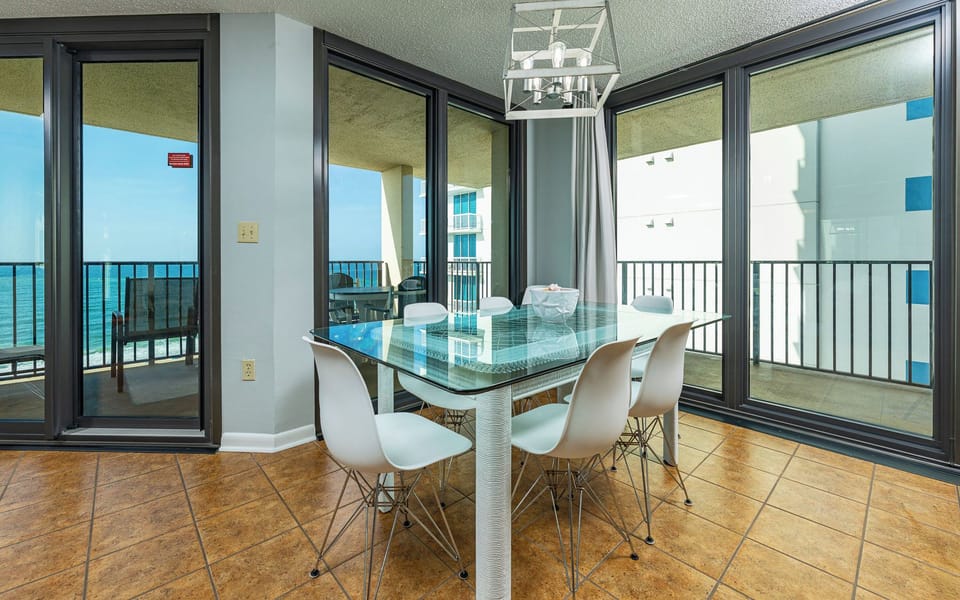 Bask in natural light as you gather around the stylish dining table, soaking in the coastal vibe