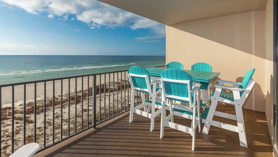 Enjoy meals or drinks at the outdoor patio table while taking in the beautiful views from your beachfront balcony