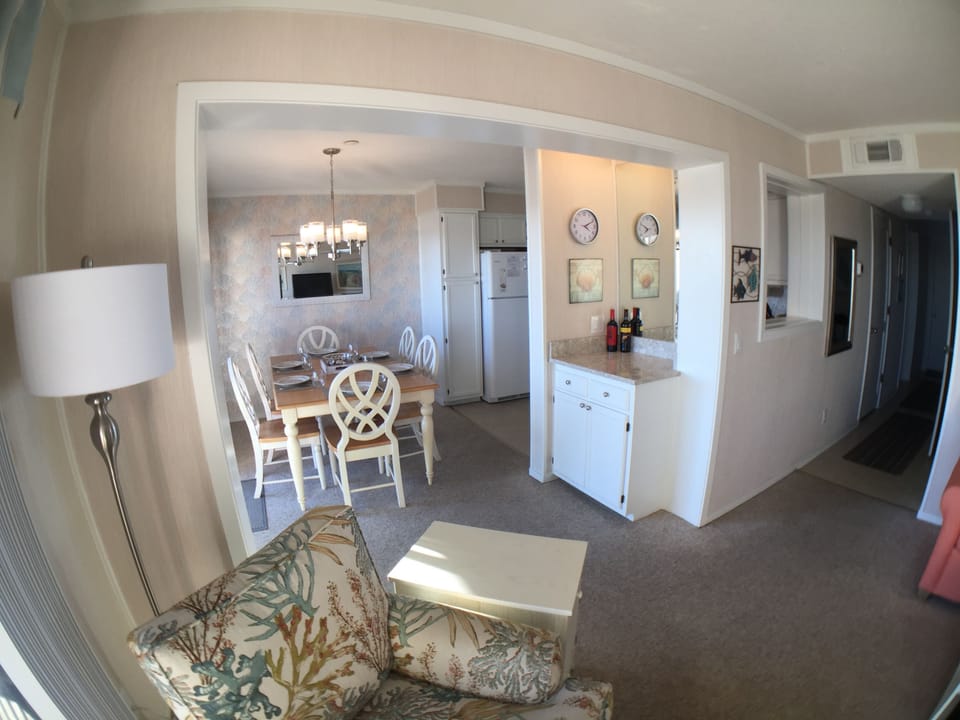Into the dining room and kitchen. Dry bar for storage.