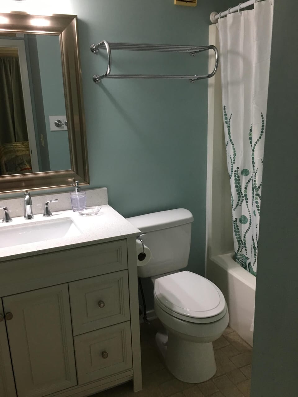 Master en-suite bathroom. New vanity, quartz counter, sink, and fixtures.