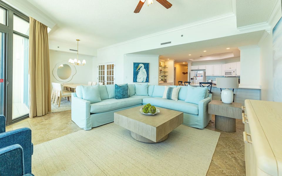 You settle into the plush sectional with a queen sleeper in the living room and feel the calm of coastal comfort