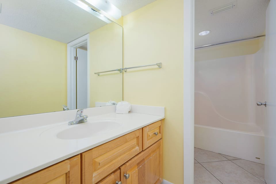 Towels await as you refresh at the sink and prepare for a day of coastal adventures nearby