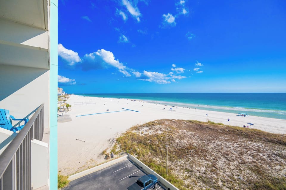 Breathe in the fresh coastal air from your balcony as you unwind while soaking in the expansive beach views