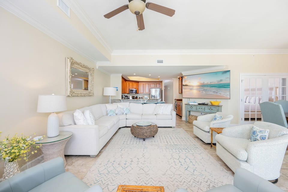 Sink into the plush seating in this living space, featuring a sofa with queen sleeper, and enjoy a family movie night