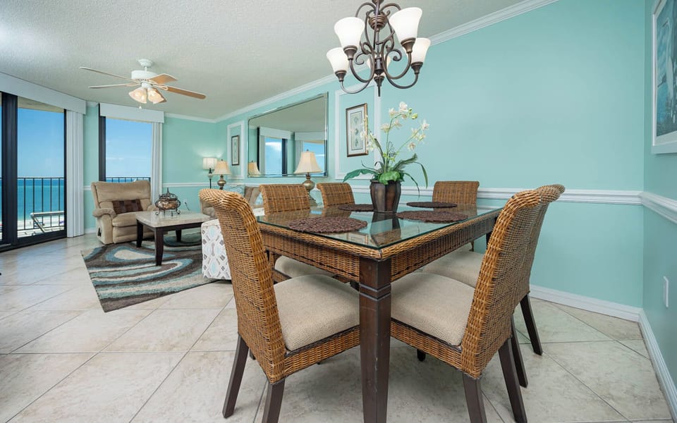 Enjoy meals with a view in this inviting dining area, featuring a glass table and six chairs