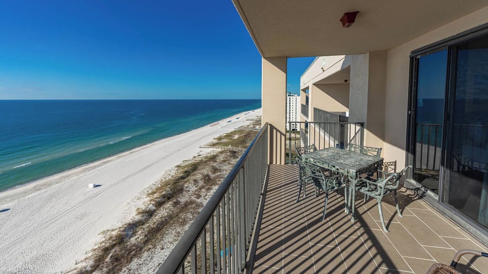 Dine al fresco at the outdoor patio table while enjoying breathtaking views of the coastline and tranquil waters