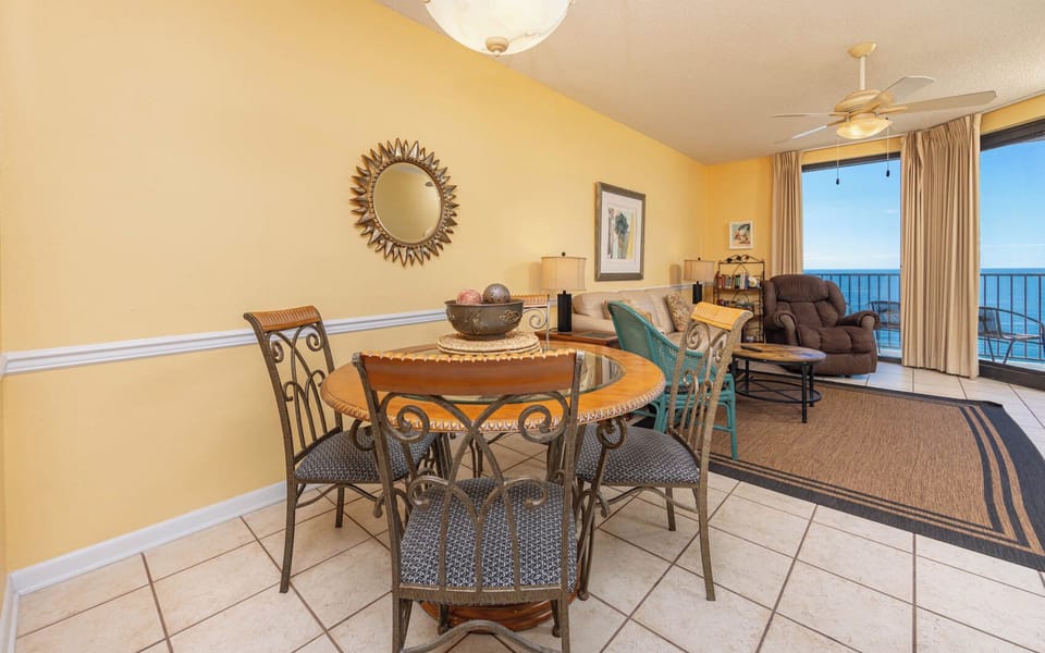 Gather around the round dining table, where you can enjoy meals with a view of the beach through large windows