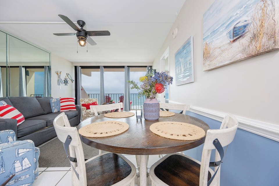 Gather around the charming dining table to share laughter and stories while enjoying coastal views together