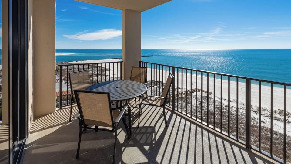 Enjoy meals or morning coffee at the round table while taking in the beautiful coastal views from your balcony