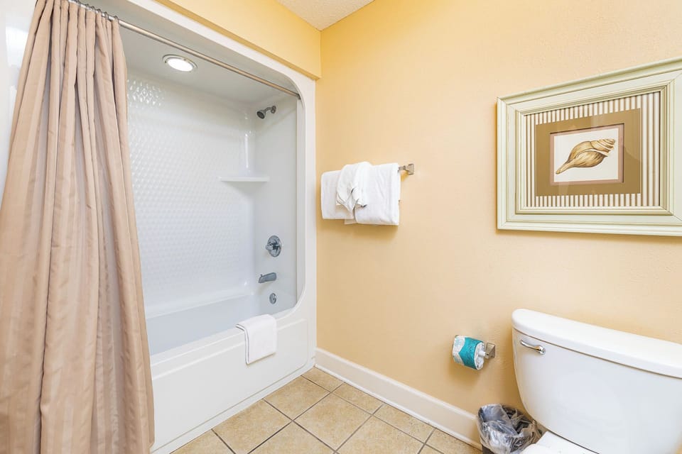 A warm shower refreshes you after a day exploring the coast in this guest suite bathroom