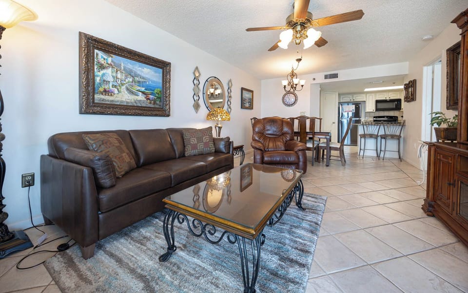 Relax in the comfortable living area with a queen sleeper sofa, decorative art, and a welcoming atmosphere