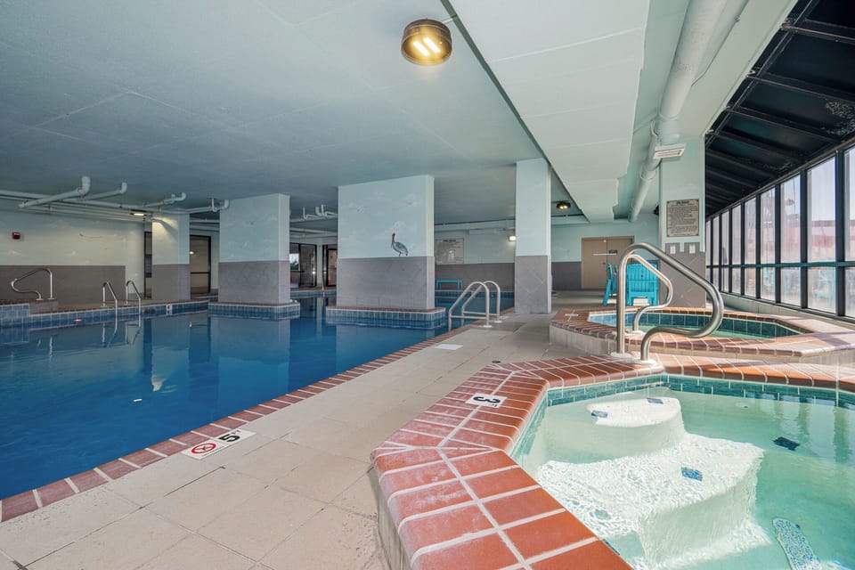 Unwind in the indoor pool and hot tub area at Phoenix X, perfect for a refreshing swim after a day on the Alabama Gulf Coast