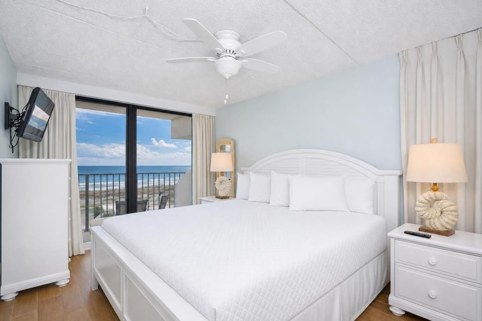 Drift off to sleep as gentle breezes from your balcony bring the soothing sounds of the coast into this king master suite