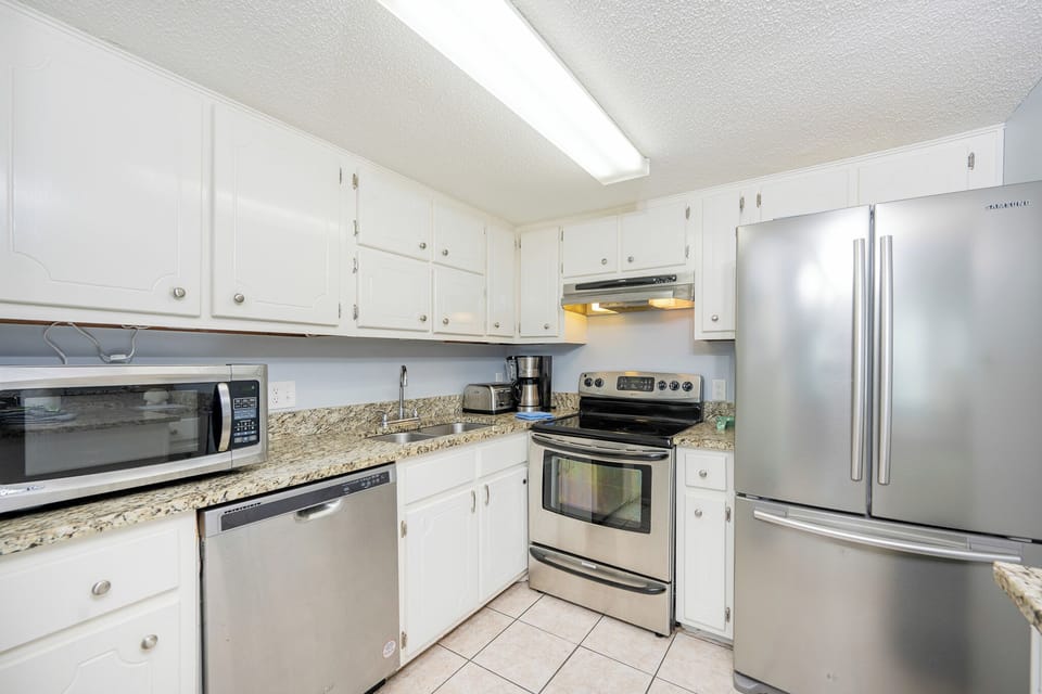 Cook up delicious family favorites in the bright kitchen, where stainless appliances and granite countertops await