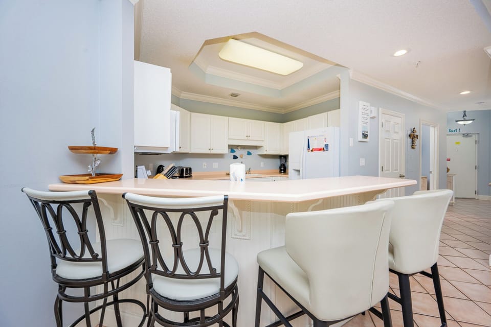 Savor your morning coffee at the breakfast bar while chatting and enjoying the inviting kitchen atmosphere