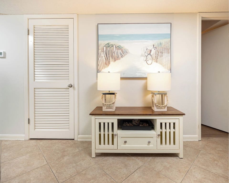 Welcome to your inviting entryway, featuring charming decor, a stylish table, and soft lighting for a warm atmosphere