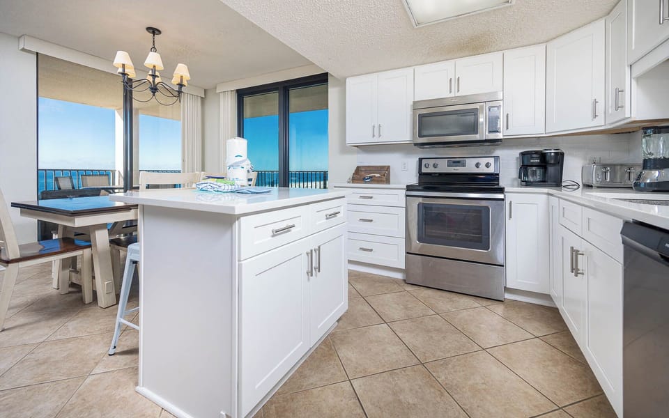 Cook and gather at in this stylish space while enjoying beachfront views through large balcony doors