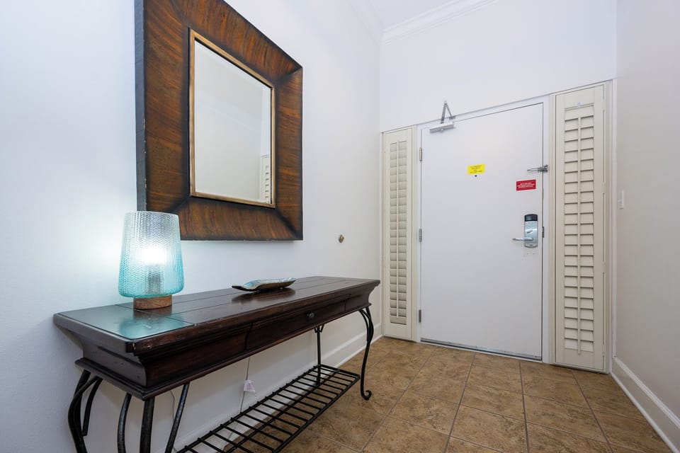 Step inside and feel welcomed by the warm vibes of this elegant entryway, inviting you to explore your beach retreat