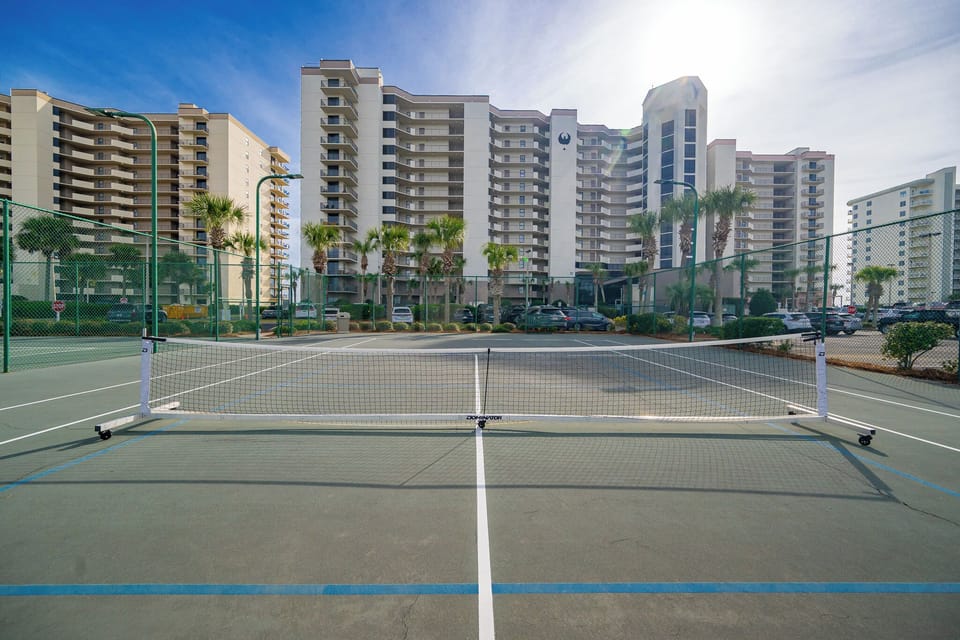 Play a match on the court at Phoenix VI, lined for pickleball or tennis