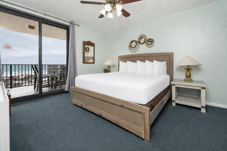 Rest easy on the king bed in the master suite while waves and breeze play beyond your balcony doors