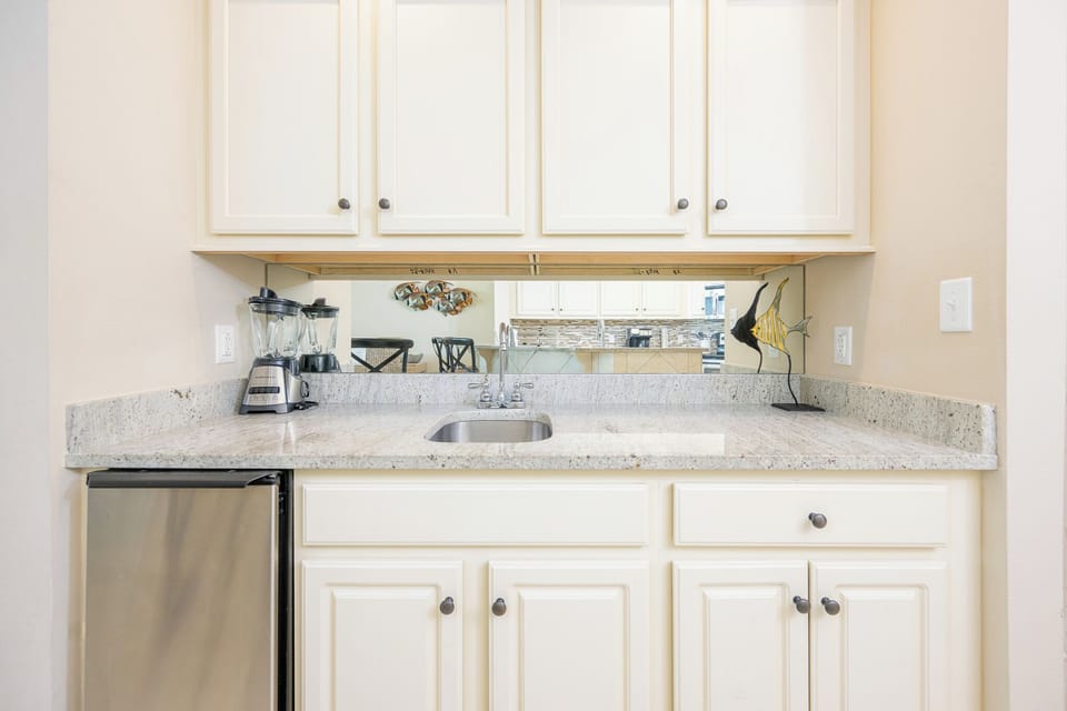 Blend refreshing drinks in this charming wet bar, perfect for creating beach-inspired cocktails alongside loved ones