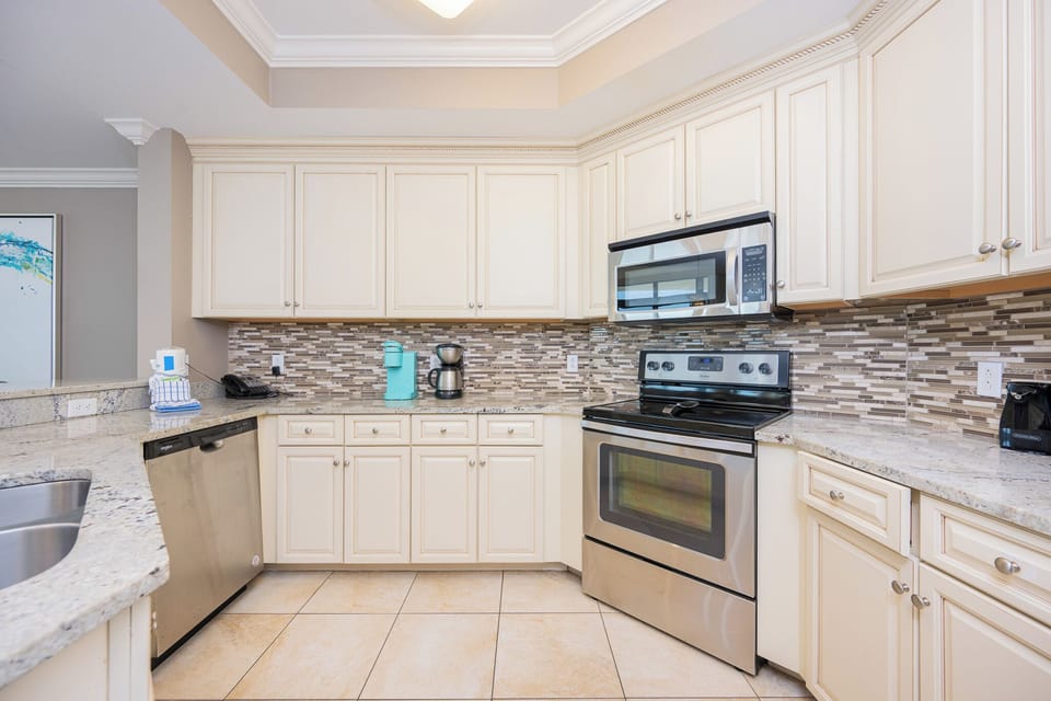 Prepare your favorite meals surrounded by sleek cabinetry and inviting countertops, making kitchen moments special