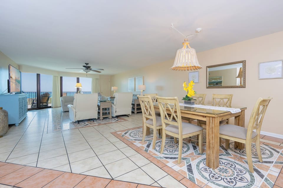 Unwind in cozy seating, enjoying the scenic views and the beach vibe while bonding with family in the inviting living space