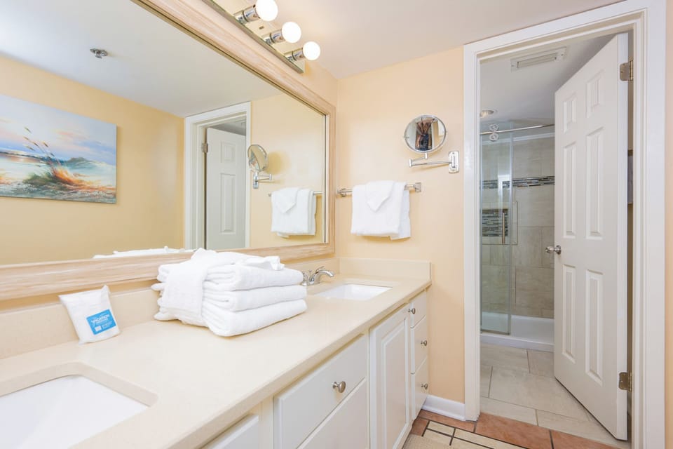 Indulge in a refreshing morning routine in the master bath with a spacious vanity and walk-in shower
