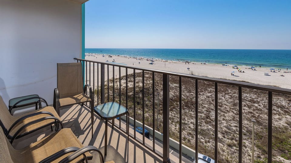 Breathe in the fresh coastal air while lounging on your balcony, soaking in the beautiful beach view