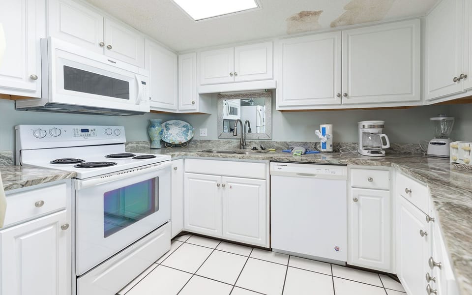 Craft tasty meals in this inviting kitchen, embracing the relaxed vibe of your beach escape