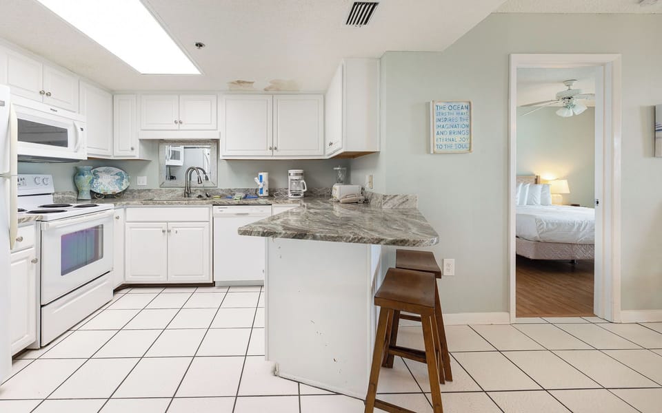 Create delicious meals and drinks at the granite countertops, while soaking in the beach vibe from the open layout