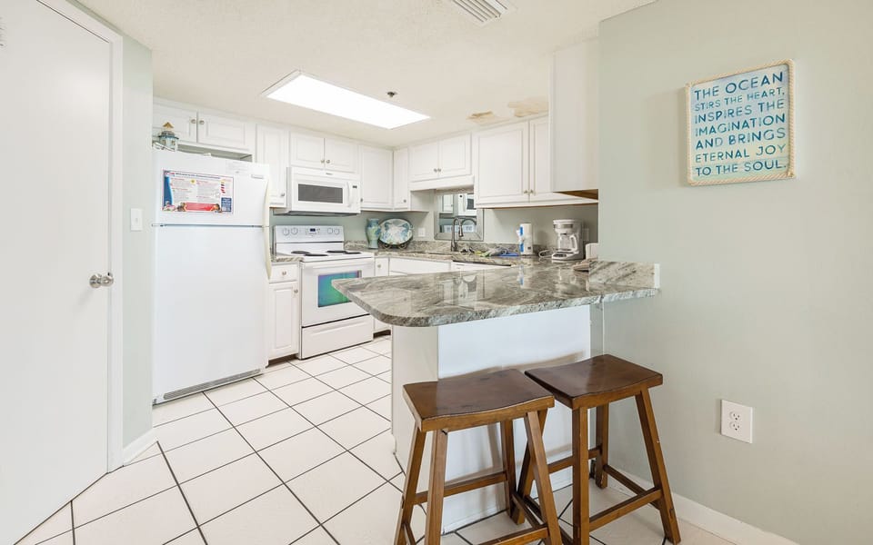 Gather your family around the breakfast bar, enjoying morning coffee and planning a day of beach fun