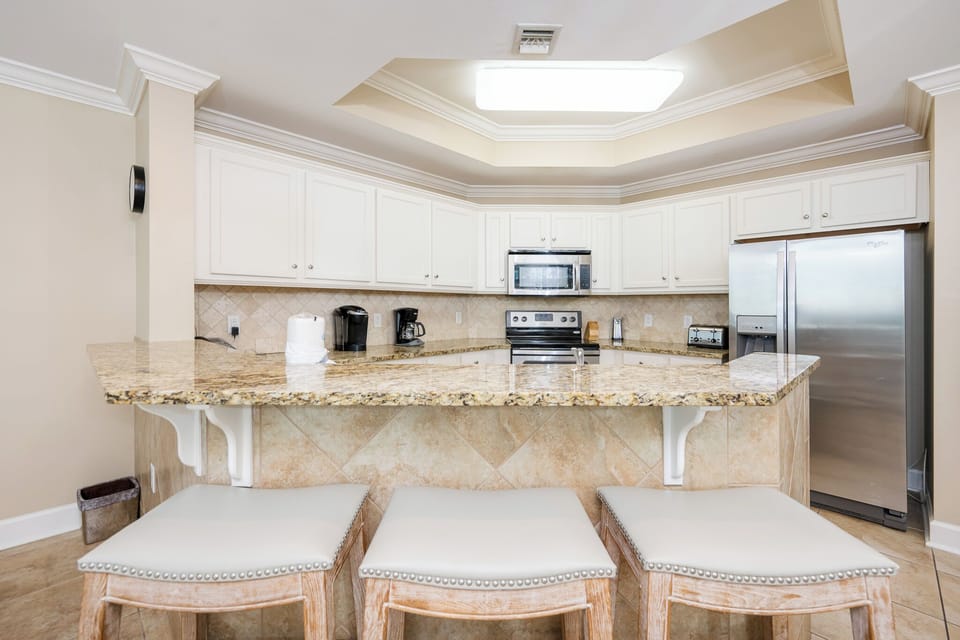 Create delightful meals together at the bar while enjoying the inviting vibe of your kitchen space