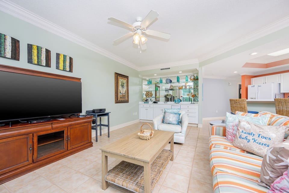 Unwind in the living room, where cozy seating invites you to enjoy the evening with your favorite show on TV