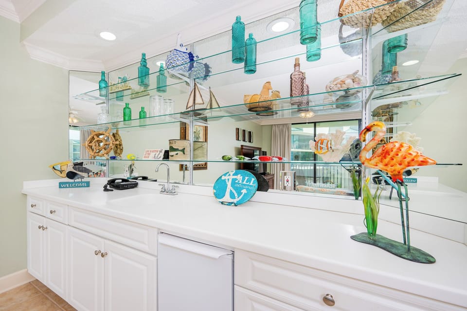Grab a chilled drink from the fridge or create your favorite cocktail at the wet bar