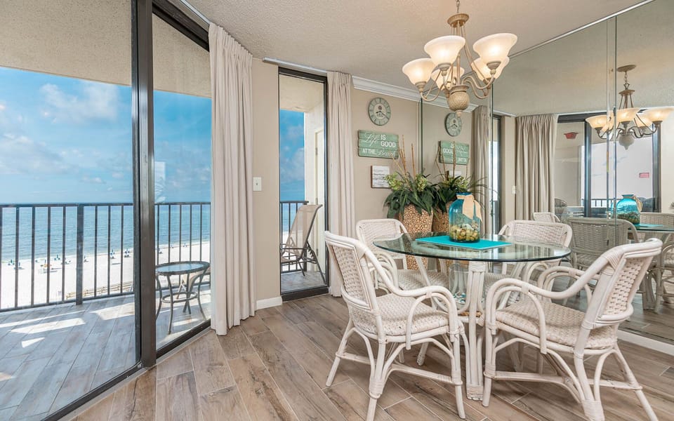 Enjoy meals at the glass dining table surrounded by natural light and views of the beach