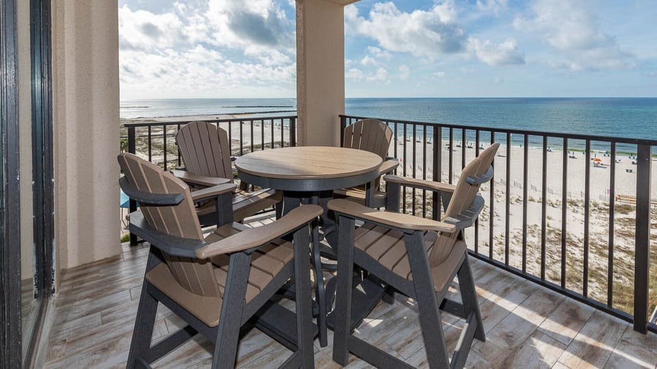 Relax at the outdoor table and enjoy the beautiful views of the beach