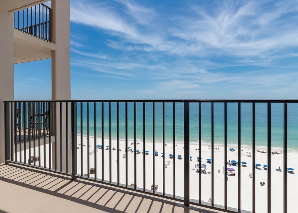 Breathe in the fresh air from the balcony while enjoying views of the tranquil waters and beach below