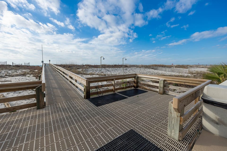 Take a stroll on the boardwalk leading to the beach, complete with outdoor showers for a refreshing rinse after your day