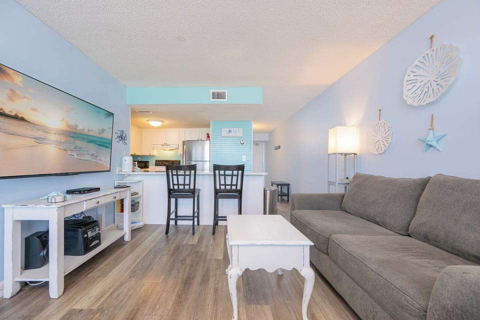 Unwind after a day at the beach in this inviting living space for movie night and relax