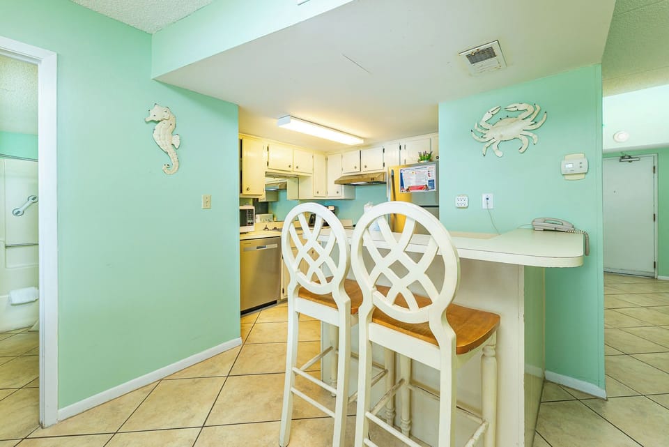 Gather around the bar stools to share laughter while planning your next adventure along the coast