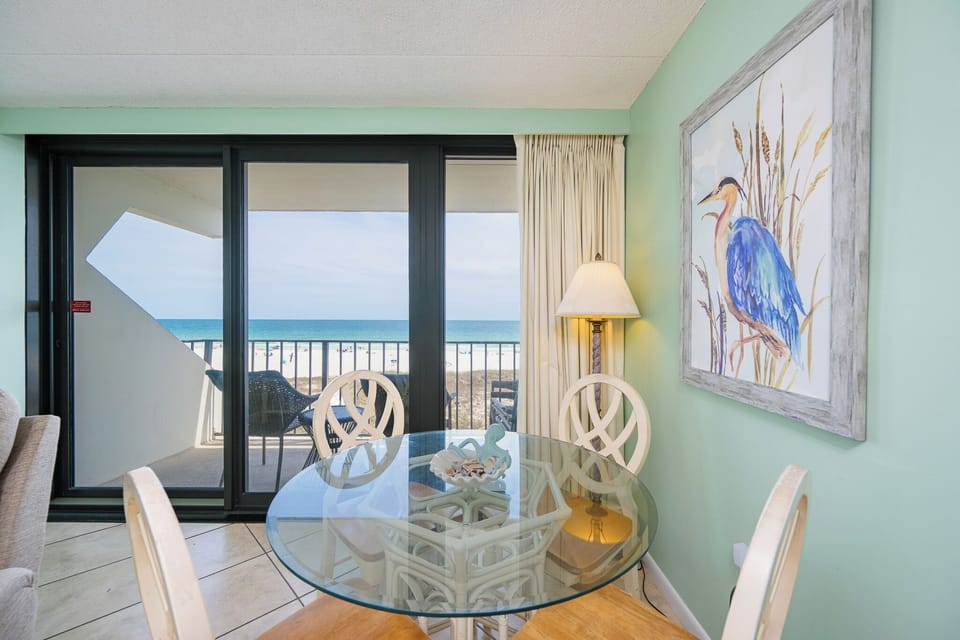 Savor the coastal vibe from your balcony while enjoying the gentle sounds of waves as you unwind