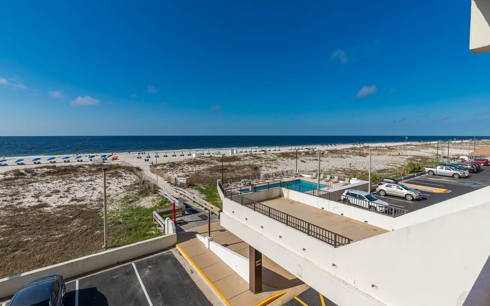 Enjoy stunning beachfront views from this inviting balcony, perfect for relaxation and soaking in the coastal atmosphere