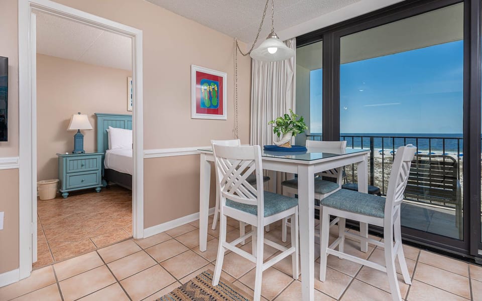 Enjoy meals at this bright dining area with stunning beachfront views and a welcoming atmosphere