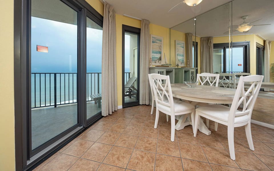 Dine at the round table while enjoying beach views from the balcony